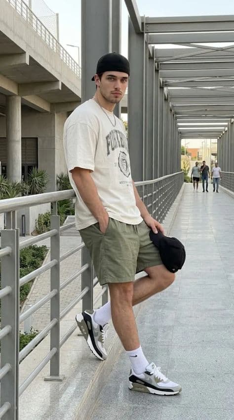 Full-body summer streetwear portrait of a relaxed subject bathed in natural golden sunlight