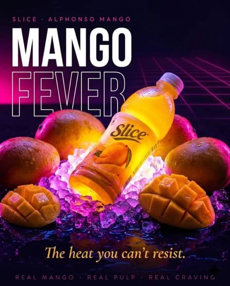 A frosty mango juice bottle resting on crushed ice with neon pink lighting and juicy mango slices.
