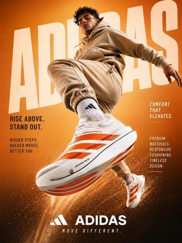Athletic male model jumping mid-air toward camera in sportswear advertisement with oversized sneakers, orange gradient background, and dynamic motion effects.