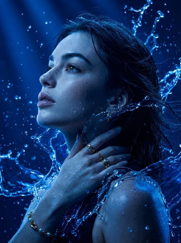 Hyper-detailed cinematic side-profile portrait illuminated with electric blue light and surrounded by liquid energy effects against a dark futuristic background.