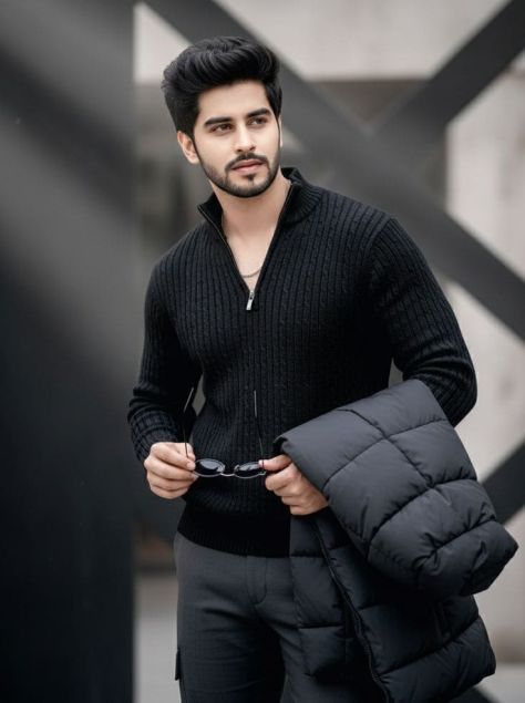 Photorealistic three-quarter portrait of a bearded man in a charcoal rib-knit sweater holding black oval sunglasses and a folded puffer jacket in a blurred geometric architectural setting.